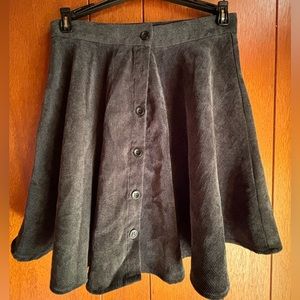 Corduroy material high waisted buttoned skirt.